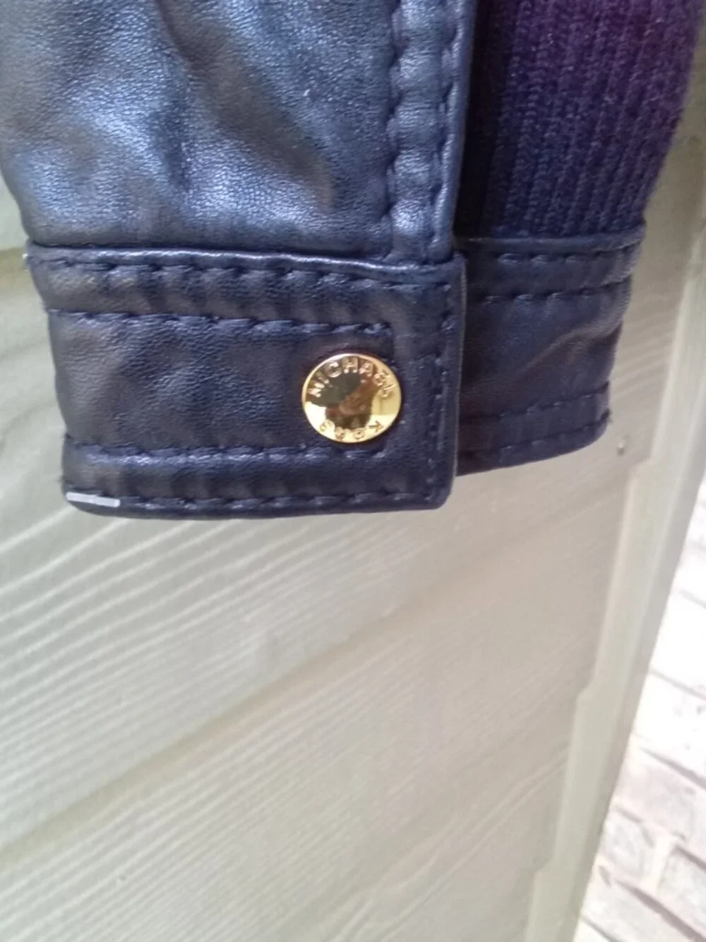 Michael Kors women's leather jacket in size M features a stylish sherpa collar